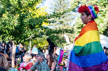 Photo of a Person  Wearing Multicolored Striped Costume