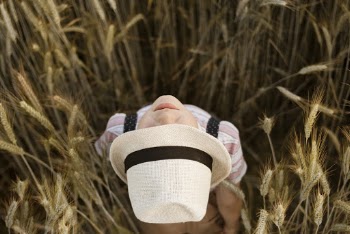Photo of a Person Wearing White Fedora Hat