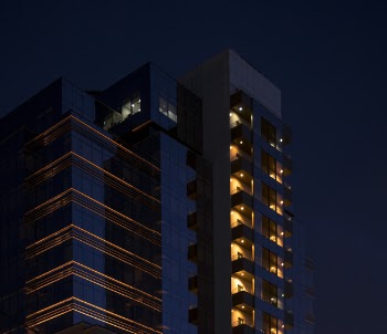 Photo of a Tall Building Under Dark Sky
