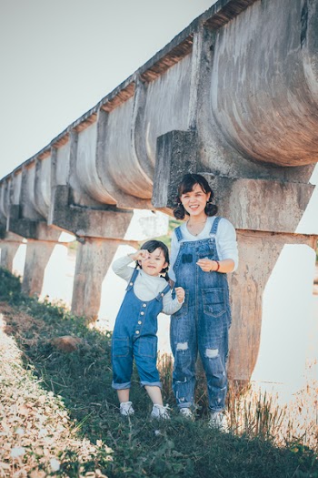 Photo of a Woman and Girl Wearing Blue Denim Overall Suits 