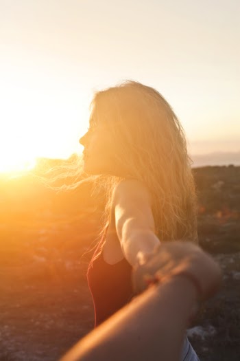 Photo of a Woman at Sunset