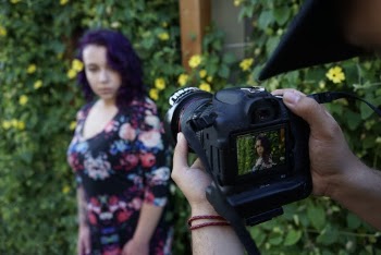 Photo of a Woman Being Captured by Camera