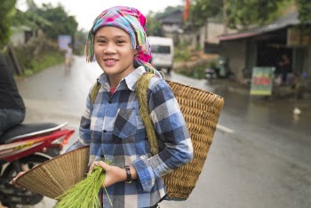 Photo of a Woman Carrying Wicker Backpack
