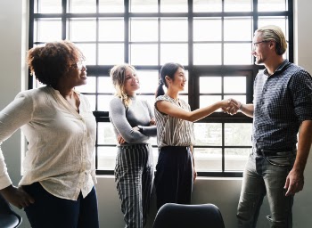 Photo of a Woman Handshaking with a Man