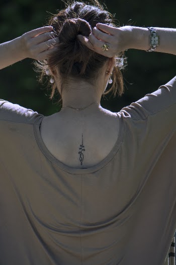 Photo of a Woman Holding Her Hair