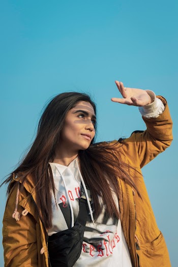 Photo of a Woman in Brown Zip-up Jacket