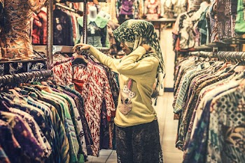 Photo of a Woman Inside a Clothing Store