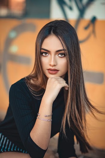 Photo of a woman leaning her chin on her hand