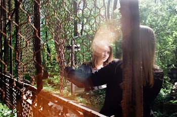 Photo of a Woman Looking in a Mirror