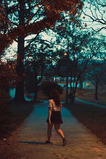Photo of a Woman Near a Tree