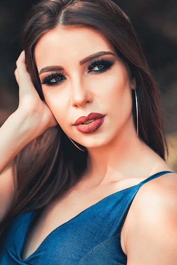 Photo of a Woman posing for photo shoot with long hair