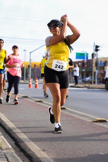 Photo of a woman running in a marathon