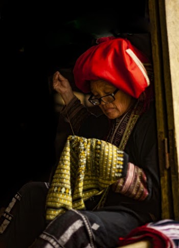 Photo of a Woman Sewing Clothes