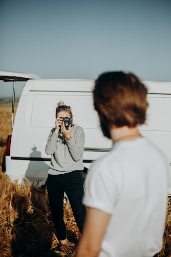 Photo of a Woman Taking a Man's Photo
