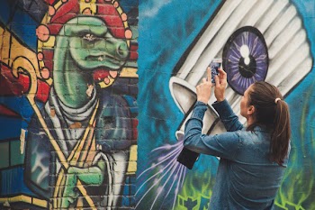 Photo of a Woman Taking Picture