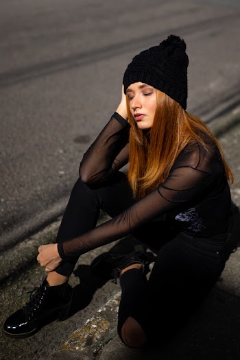 Photo of a Woman Wearing Black Beanie
