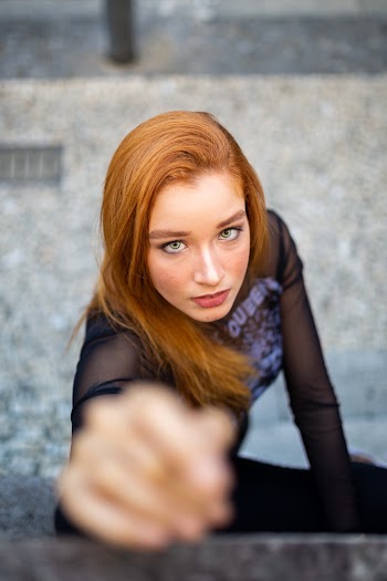 Photo of a Woman Wearing Black Mesh Long Sleeves Shirt