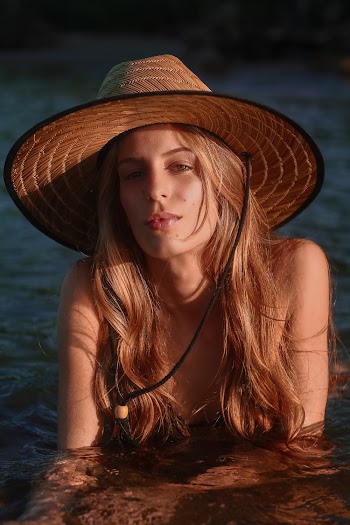Photo of a Woman Wearing Brown Hat