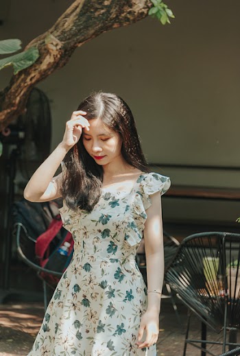 Photo of a Woman Wearing Floral Dress