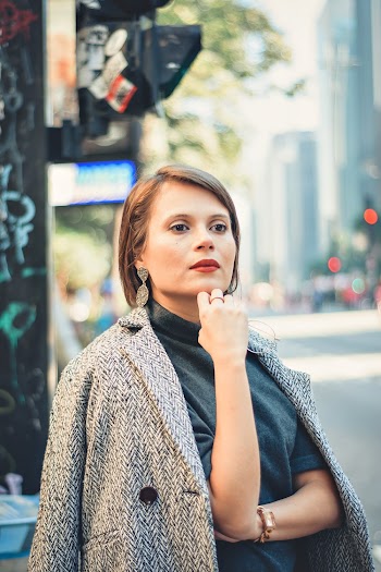 Photo of a Woman Wearing Gray Coat