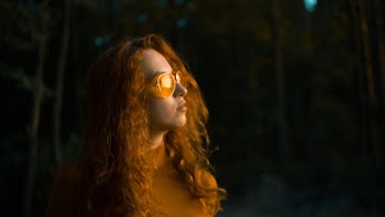 Photo of a Woman Wearing Orange  Sunglasses