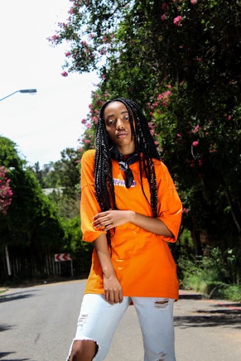 Photo of a Woman Wearing Orange T-Shirt