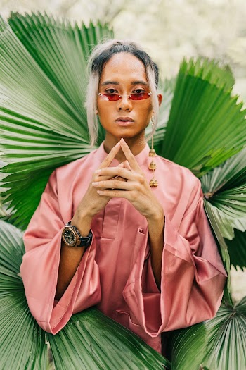 Photo of a Woman Wearing Pink Dress