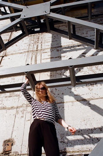 Photo of a Woman Wearing White and Black Striped Top 