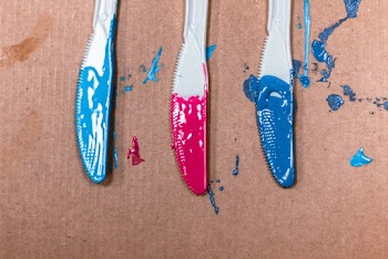 Photo of   Acrylic Paints applied on  Three Steel Knives
