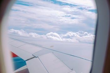 Photo of Airplane Wing During Daytime