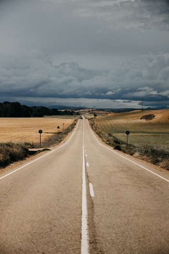 Photo Of An Empty Roadway During Daytime