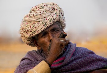 Photo Of An Old Man Smoking Pipe