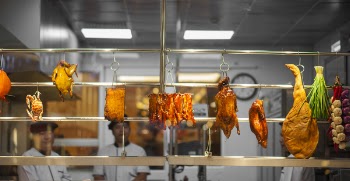 Photo of Assorted Food Hanging on Gray Metal Railings
