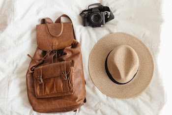 Photo Of Backpack Near Hat