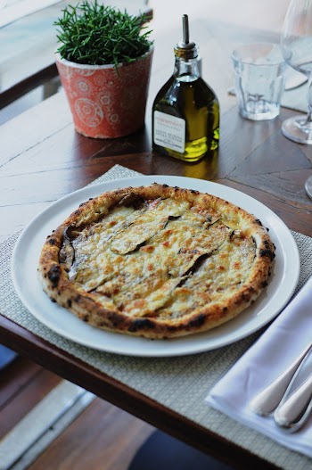 Photo of Baked Pizza on Round White Plate
