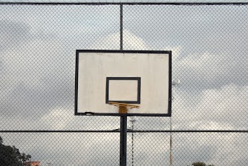 Photo of Basketball Hoop Near Cyclone Fence
