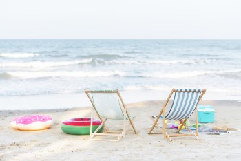 Photo of Beach Chairs On Seashore