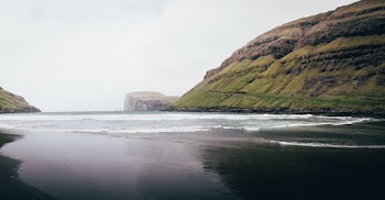 Photo of Beach Near Mountains