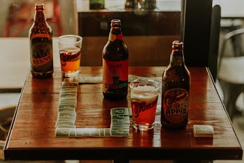 Photo Of Beer Bottles On Top Of Wooden Table
