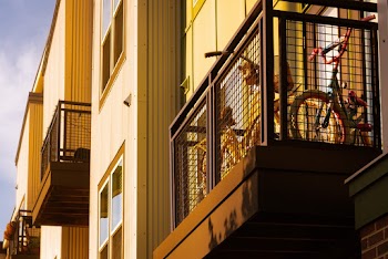 Photo of Bicycles Parked on the Balcony of a Building