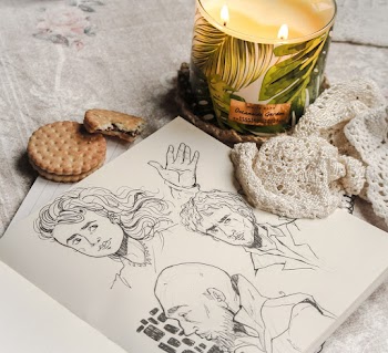 Photo of Biscuit Beside Sketchpad