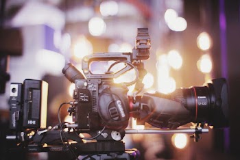 Photo of Black Canon Dslr Camera With Tripod