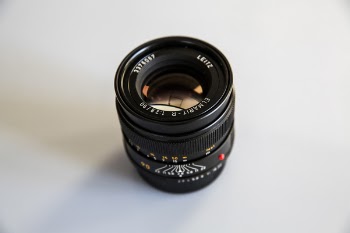 Photo of Black Zoom Lens on White Surface