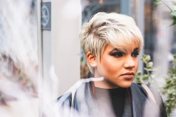 Photo of Blonde Woman in Black Top