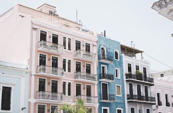 photo of blue and pink painted high-rise building