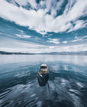 Photo of Boat Under Cloudy Sky