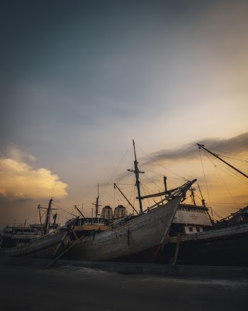 Photo of Boats During Dawn