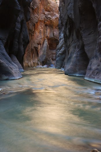 Photo of Body of Water Surrounded by Rock Formation