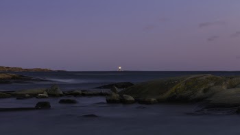 Photo of Body of Water with Boulders