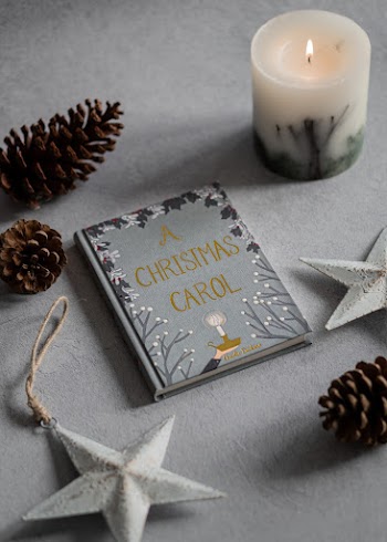 Photo Of Book Near Candle